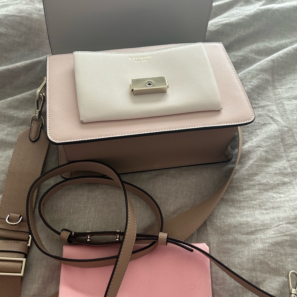 One kate spade bag. Never used. Includes both straps and dust bag